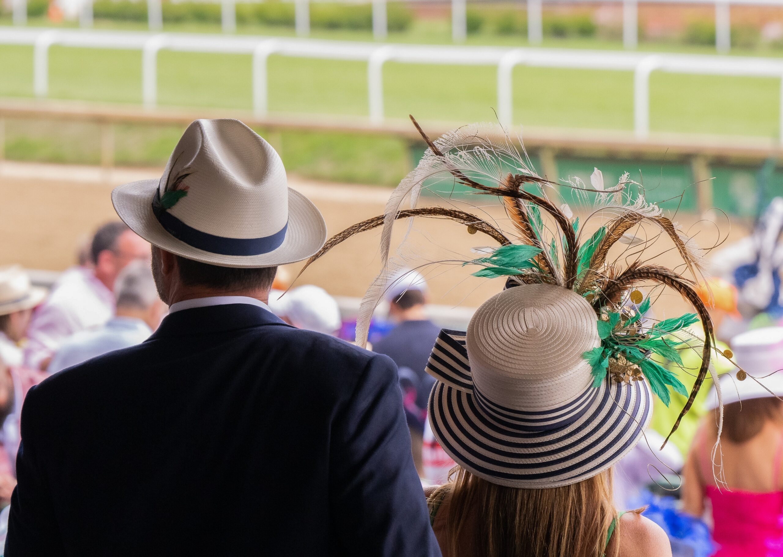 Two formally dressed racegoers at Ascot weekend